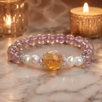 Natural ametrine citrine healing bracelet with gemstone beads displayed beside candles for calming style.