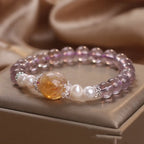 Natural ametrine citrine healing bracelet displayed with polished crystal beads and pearl accents.