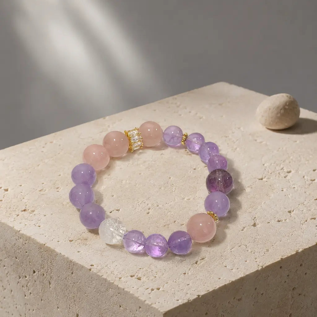 Natural Rose Quartz Amethyst Clear Quartz Crystal bracelet displayed on textured stone with calming luxury appeal.