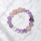 Natural Rose Quartz Amethyst Clear Quartz Crystal bracelet displayed on marble with refined crystal jewelry styling.