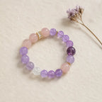 Natural Rose Quartz Amethyst Clear Quartz Crystal bracelet styled beside flowers with elegant crystal beauty.