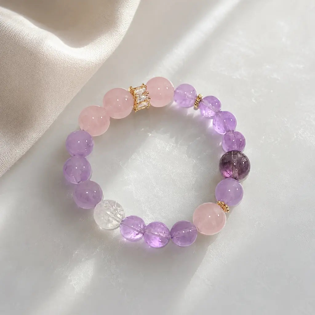 Natural Rose Quartz Amethyst Clear Quartz Crystal bracelet styled with soft light and elegant gemstone reflections.