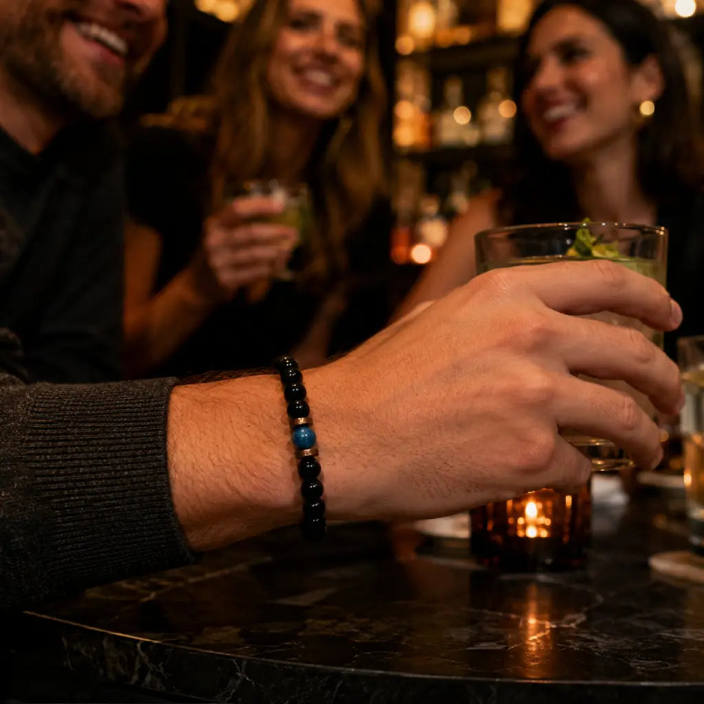 Obsidian lapis lazuli bracelet worn at a social gathering with polished black gemstone beads for modern luxury accessories.