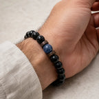 Obsidian lapis lazuli bracelet paired with casual neutral clothing, featuring polished black gemstone beads for timeless elegance.
