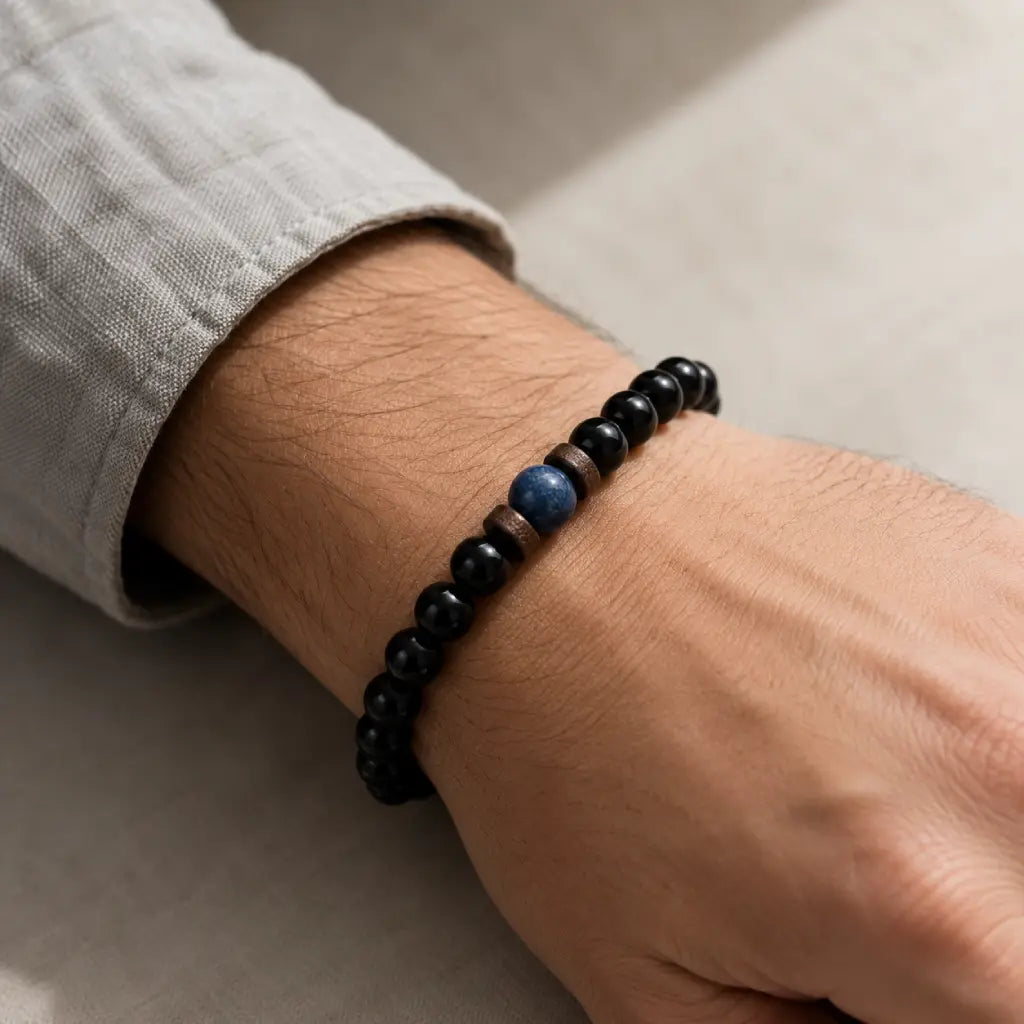 Obsidian lapis lazuli bracelet featuring glossy black gemstone beads and a blue lapis centerpiece for refined casual style.