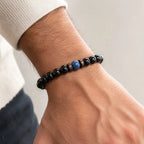 Obsidian lapis lazuli bracelet with polished black gemstone beads and a natural blue centerpiece, perfect for minimalist everyday wear.