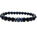 Obsidian lapis lazuli bracelet showcasing natural blue lapis lazuli, black obsidian gemstone beads, and handcrafted wood spacers for timeless style.