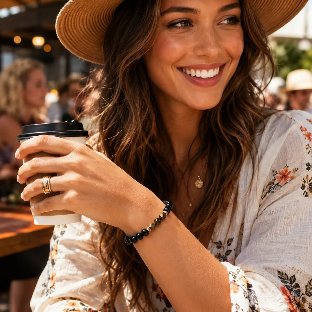 Obsidian tiger eye bracelet styled with boho fashion and coffee cup, elegant crystal jewelry for everyday wear
