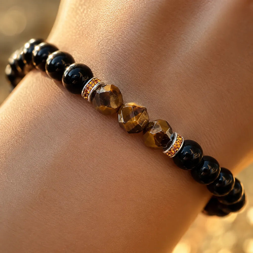 Obsidian tiger eye bracelet closeup featuring faceted gemstones and glossy black beads for premium energy style