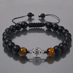 Onyx and Tiger eye bracelet with reflective surface styling and matte gemstone beads for modern fashion.