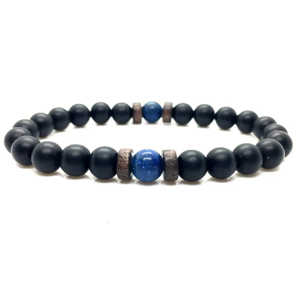 Navy blue beaded bracelet with a blue stone and bronze accents on a white background