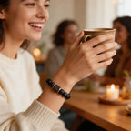 Woman holding a mug with a blurred background of people and candles