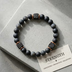 Onyx lava bracelet on concrete with matte black beads, lava stone accents, and grounding energy for inner calm