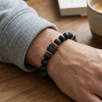 Onyx lava bracelet worn casually with matte black beads and lava diffuser stone for grounding calm daily energy