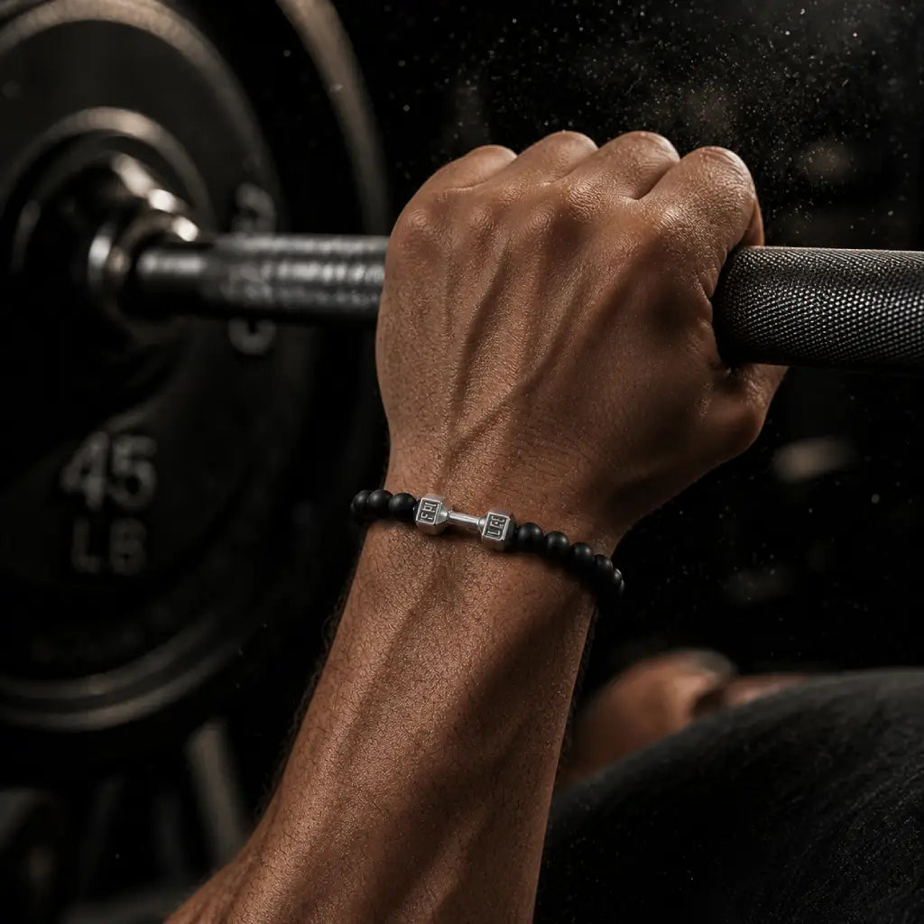 Onyx stone bracelet worn during barbell workout, highlighting strength, durability and stylish fitness accessory for active lifestyle