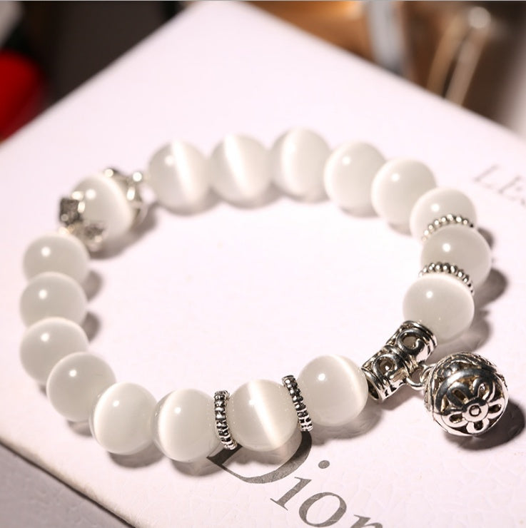Moonlit Inspiration Opal Bracelet with genuine natural Opal gemstone beads, silver-tone accents, and floral charm shown in a clean product view for daily spiritual jewelry styling.