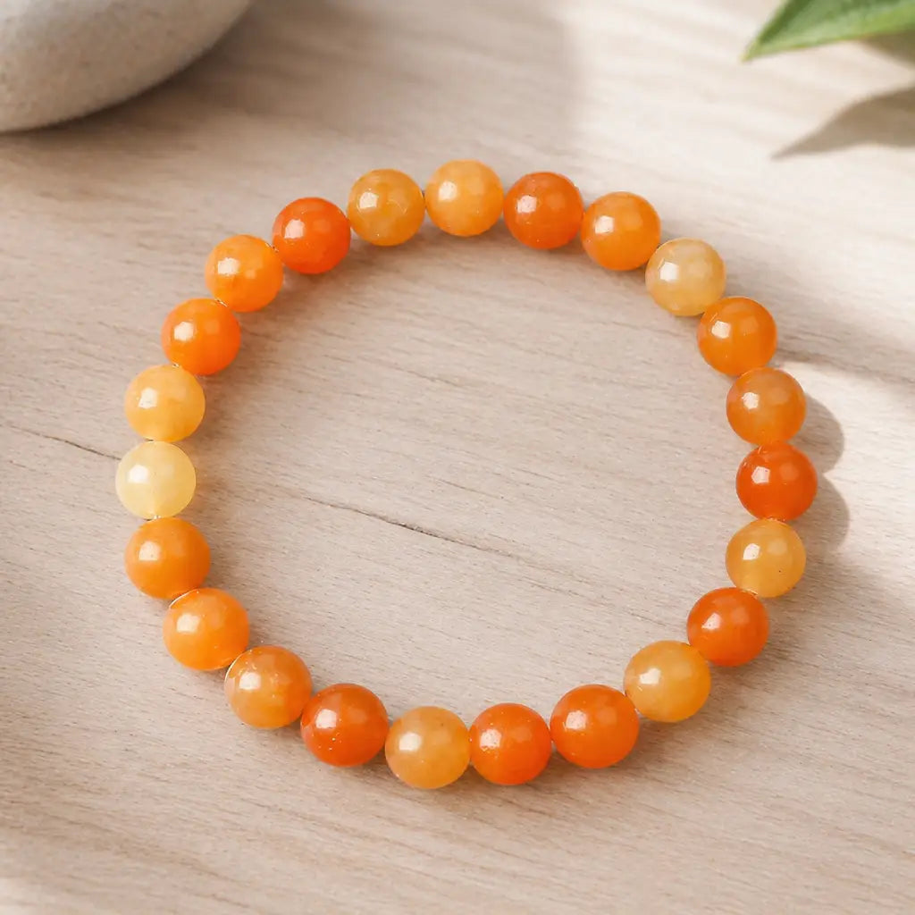 Orange aquamarine stone breacelet polished bead bracelet on wood with warm orange stones, sunny gift style look