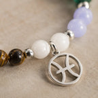 Pieces zodiac bracelet detail showcasing Pisces zodiac charm with crystal beads and premium jewelry finishing