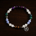 Pieces zodiac bracelet presented on wooden background highlighting gemstone jewelry and astrology gift appeal
