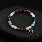 Pieces zodiac gemstone bracelet showcased on display pedestal highlighting Pisces charm and elegant bead design