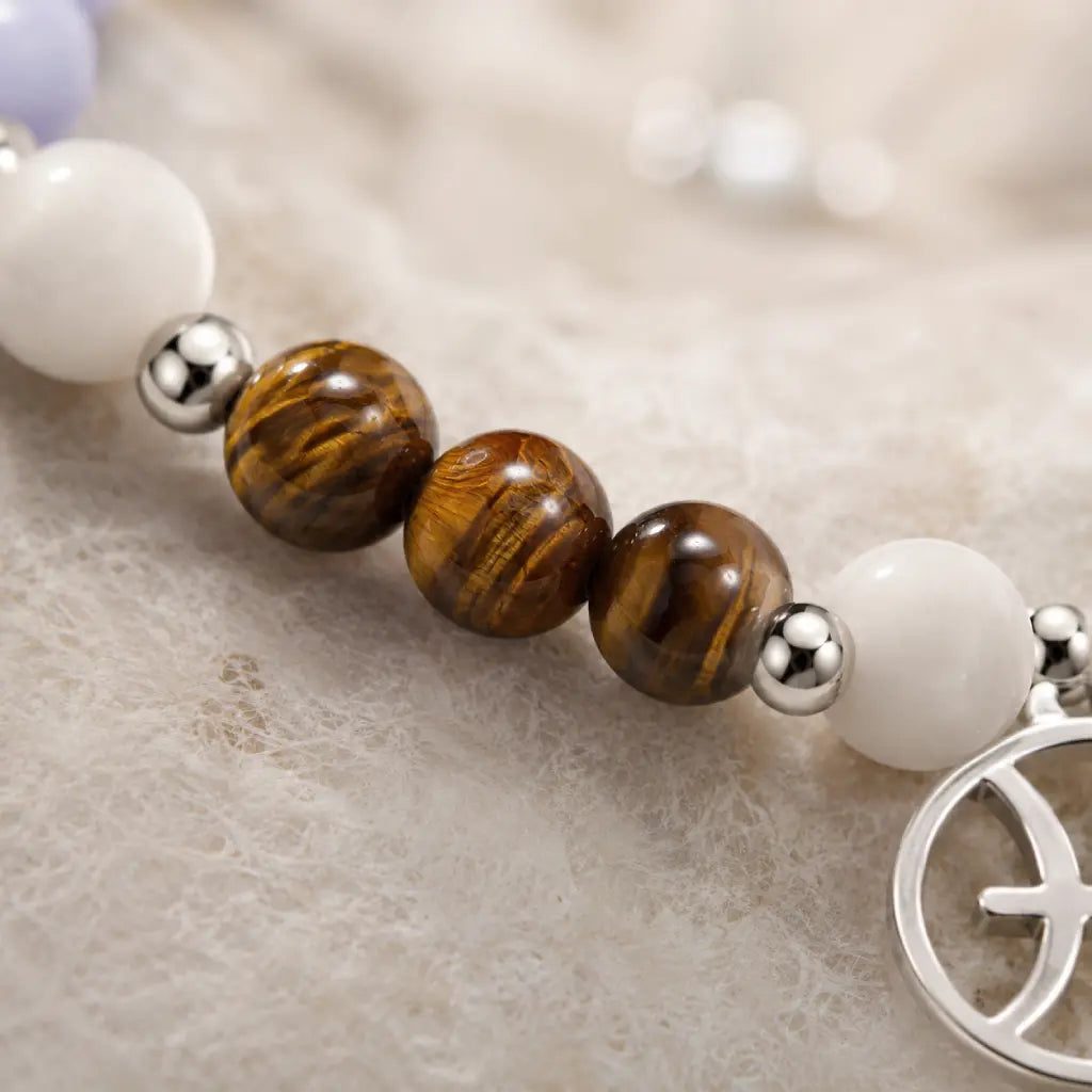 Pieces zodiac gemstone bracelet macro view highlighting tiger eye beads and luxury astrology jewelry materials