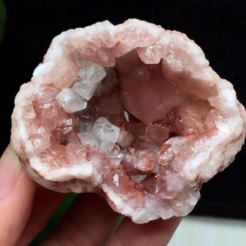 Pink amethyst geode showcasing a natural crystal pocket with translucent quartz formations, adding elegance to any crystal collection.