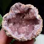 Pink amethyst geode featuring a natural pale pink druzy crystal cavity with sparkling quartz formation for elegant crystal décor.