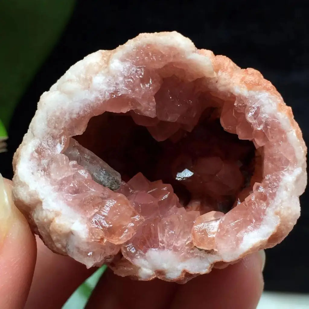 Pink amethyst geode featuring sparkling pink quartz crystals inside a natural geode, perfect for luxury home décor and gifting.
