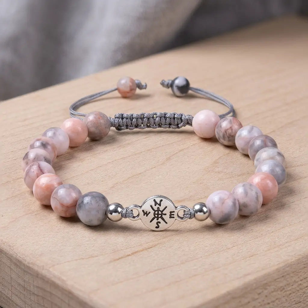 Pink Zebra Jasper artisan bracelet with soft pink and gray beads on wooden surface for elegant everyday wear