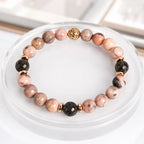 pink zebra jasper beaded bracelet with black lava stones and elegant gold details for daily wellness