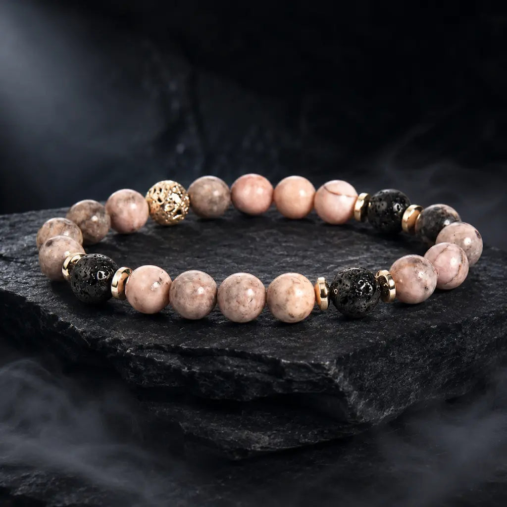 pink zebra jasper beaded bracelet with black lava stones on textured slate for premium style appeal
