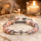 Pink Zebra Jasper healing bracelet with soft candlelight ambiance and polished beads for peaceful energy wear