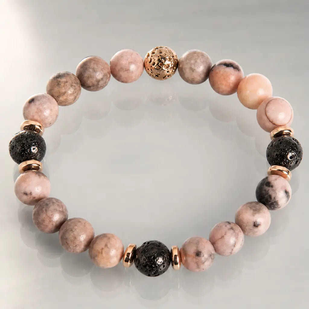 pink zebra jasper jewelry bracelet with textured lava beads and gold accents for calming style appeal