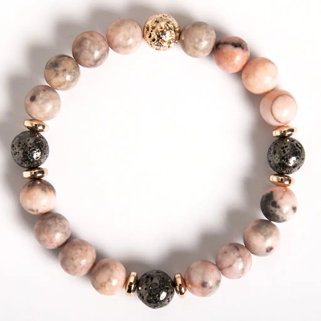pink zebra jasper bracelet with premium lava beads and gold accents for fashionable wellness wear