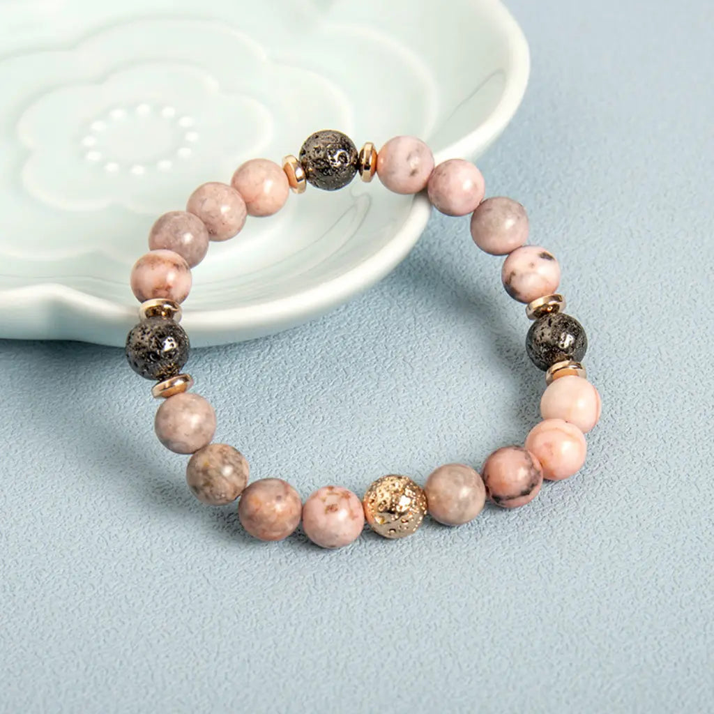 pink zebra jasper lava bead bracelet with natural gemstone details for elegant wellness styling