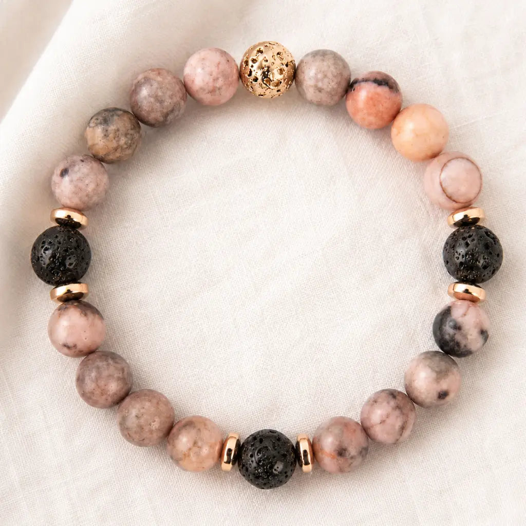 pink zebra jasper bracelet featuring natural lava stones and gold accents for stylish wellness comfort
