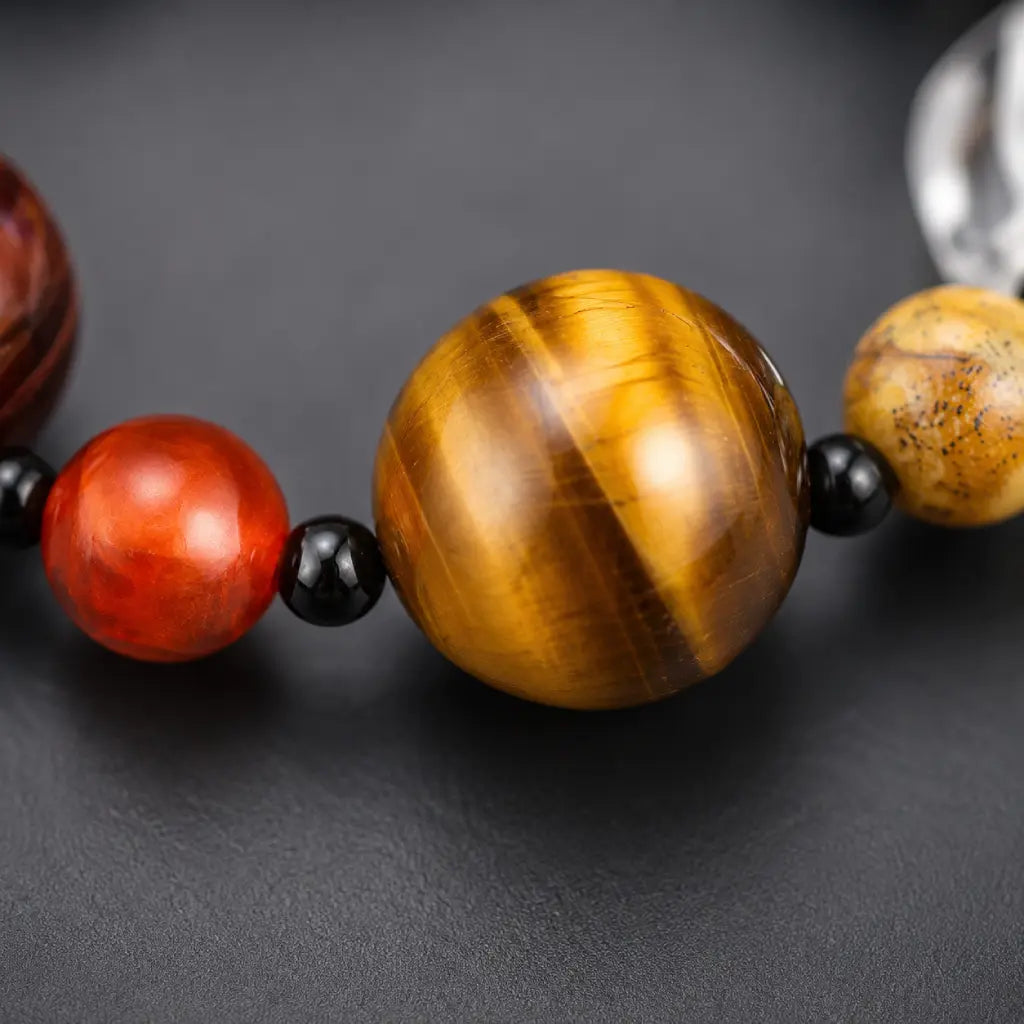 Planet bead tiger eye bracelet close-up showcasing the polished golden tiger eye bead with rich natural chatoyancy and premium gemstone craftsmanship.