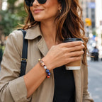 Planet bead tiger eye gemstone bracelet styled with a trench coat and coffee, adding colorful natural stones to a chic modern streetwear outfit.