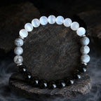 Protection bracelet with dark gemstones and healing crystals designed for grounding energy and inner focus