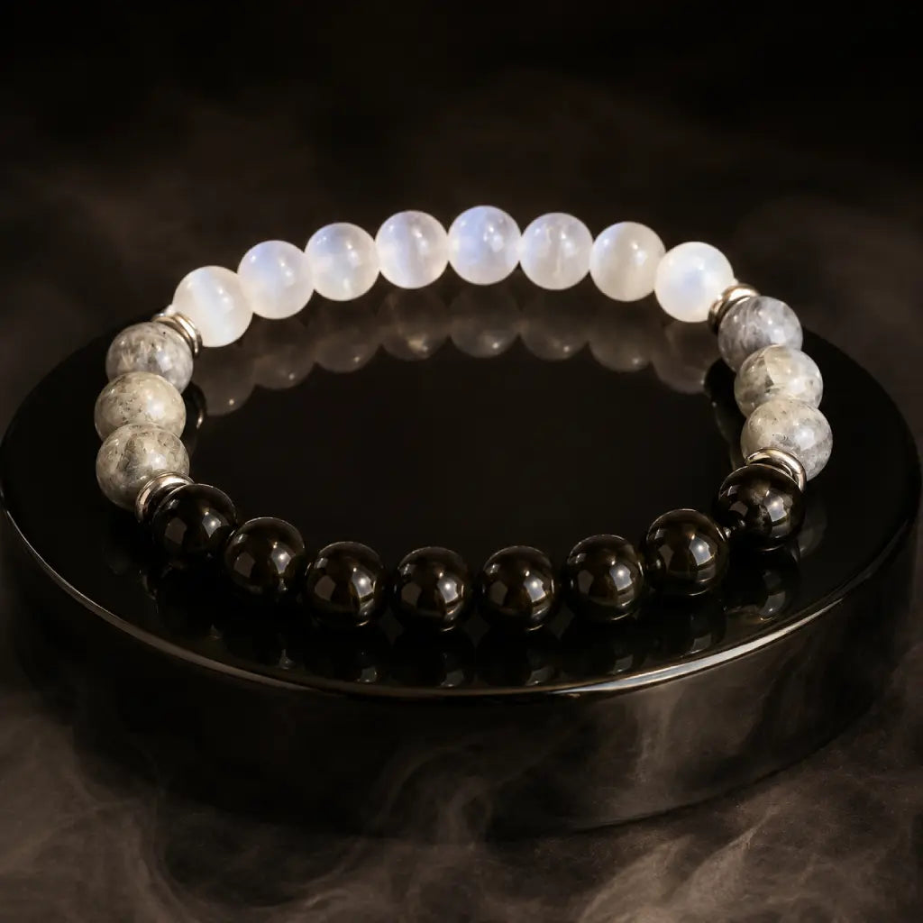 Protection bracelet displayed with dark gemstone beads and crystal jewelry for powerful energy balance