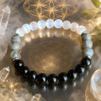 Protection bracelet surrounded by healing crystals and sacred energy symbols for mindful spiritual balance