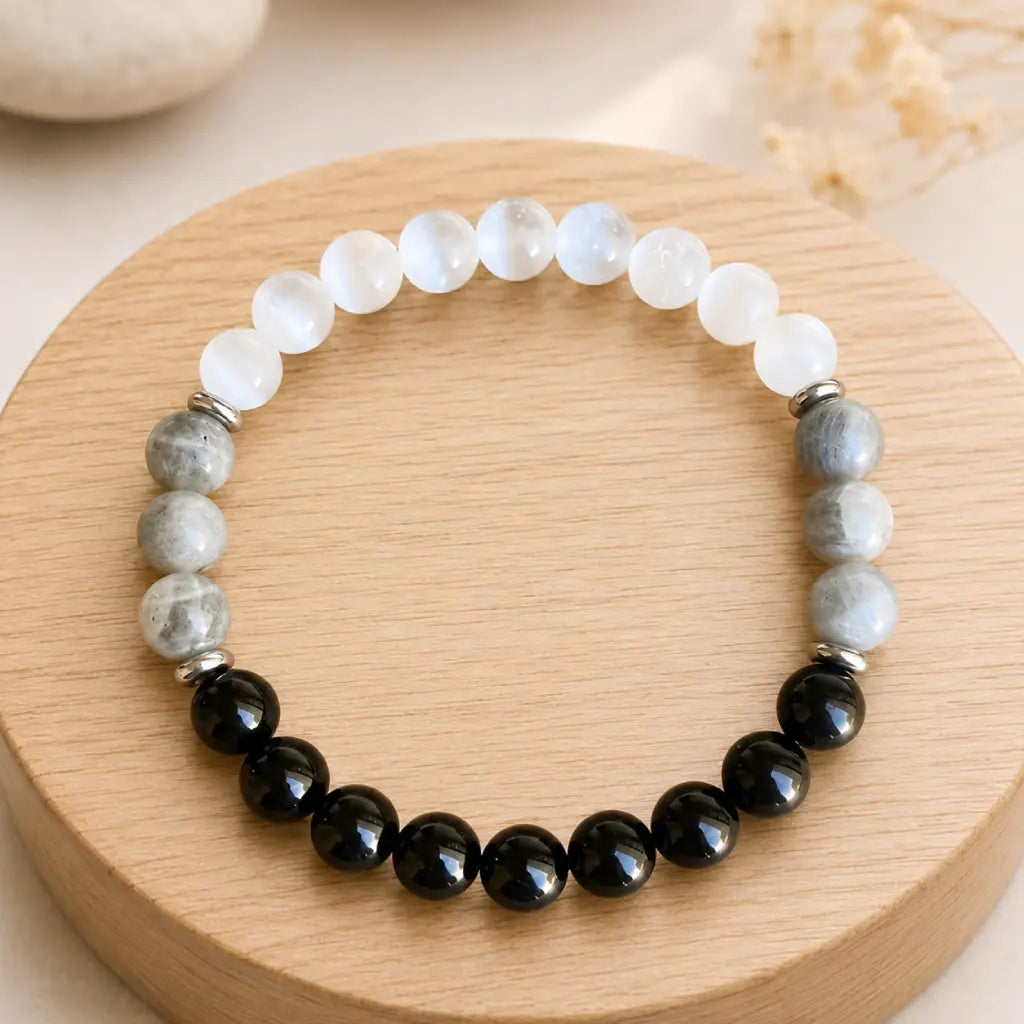 Protection bracelet on wooden display with healing crystal beads promoting balanced energy and calm focus