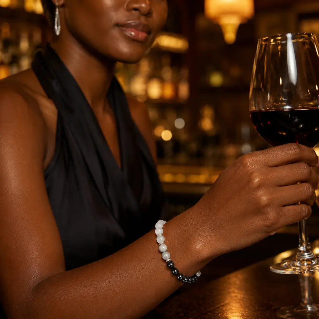 Protection bracelet paired with evening fashion and crystal jewelry for elegant energy inspired styling