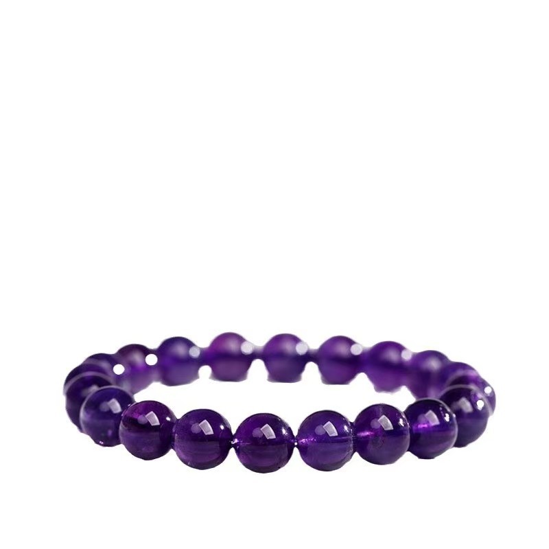 Purple glass bead bracelet with polished translucent round beads and stretch construction, isolated on pure white for a clear view of the smooth surface and rich deep purple color.