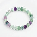 Rainbow Fluorite Crystal Bracelet featuring translucent green and purple beads, elegant clarity enhancing calming energy and focus