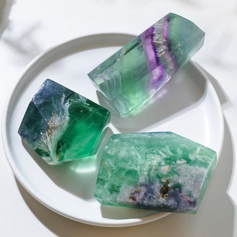 Raw fluorite crystal shown as a single natural stone with a random geometric shape, highlighting the fluorite mineral surface for display, collecting, crystal decor, or meditation.