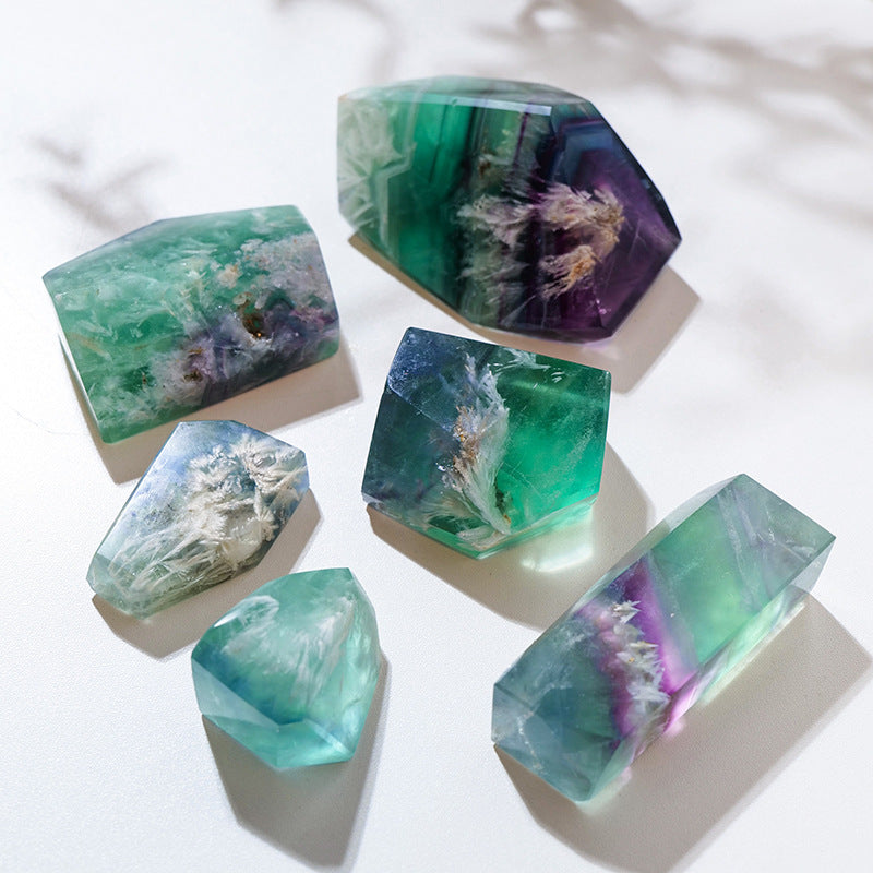 Raw fluorite crystal shown as one natural stone in a random geometric shape, with its mineral surface and natural form visible for crystal decor, collecting, or meditation display.