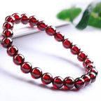 Red garnet jewelry crystal bracelet with glossy red beads, healing gemstone accessory for timeless fashion looks