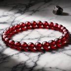 Red garnet jewelry gemstone bracelet with glossy red beads, luxury crystal accessory for evening outfits daily wear