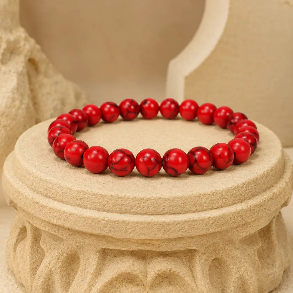 Red howlite bracelet with smooth healing crystal beads on decorative stone styling for mindful fashion